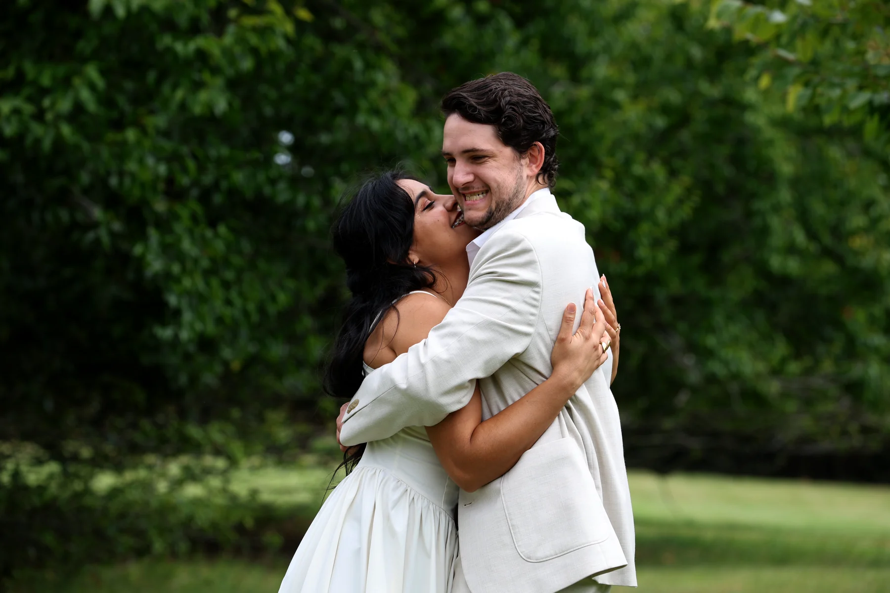 Matthew and Dalia embracing in the garden
